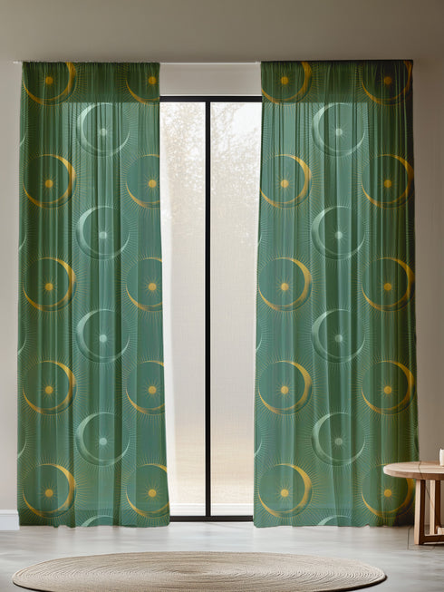 Sheer forest green curtain panel featuring repeating pattern of golden suns and silver moons with radiating lines, creating an elegant celestial motif against translucent fabric.